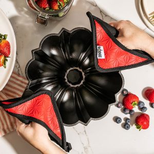 Cast Iron Fluted Cake Pan with Red Potholders